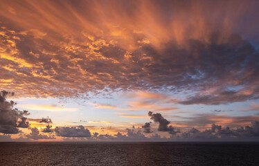 Fototapeta na wymiar Golden sky over the Caribbean Sea at sunrise/sunset