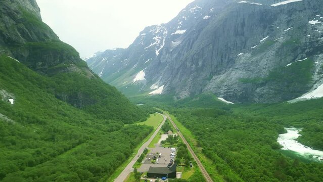 Drone Norway. Rauma Railway train runs between Andalsnes and Dombas. Famous tourist route. Norwegian travel in summer, 4k.