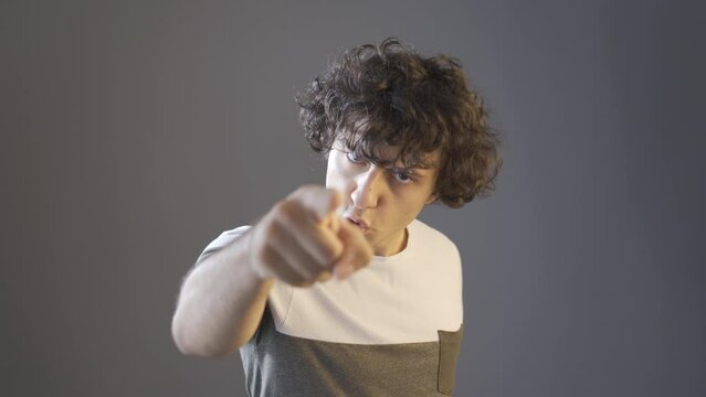 Angry and egoistic young man.