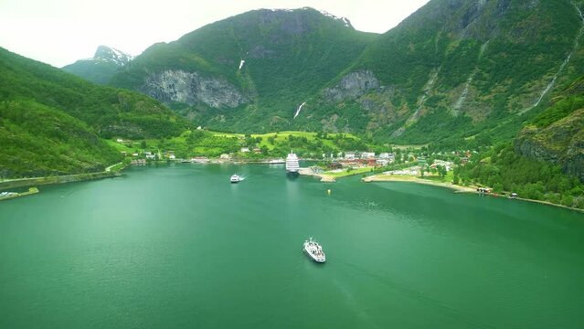 Aerial drone Norway landscape. Ferry ship in Flam Valley fjord. Norway in summer. Travel in Scandinavia. Norwegian summer tourism destination.