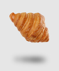 Freshly baked croissant in air on light grey background