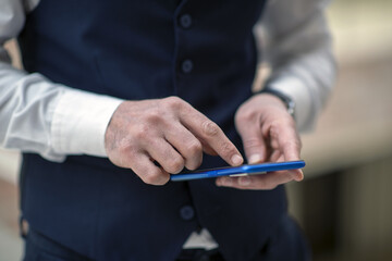 Business person talking on the phone, having a job interview, doing analysis with a tablet, and doing a job evaluation with a laptop.