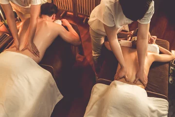 Foto op Canvas Top view couple customer enjoying relaxing anti-stress spa massage and pampering with beauty skin recreation leisure in warm candle lighting ambient salon spa at luxury resort or hotel. Quiescent © Summit Art Creations