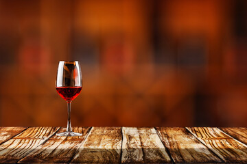 Empty table top with wine bottles in wooden rack in wine cellar.background for blurred