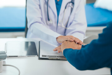 comfort, encourage, Asian people experienced female doctor giving advice to elderly male patient cancer and x-ray results and treatment options, Cancer Consultation, holding hands