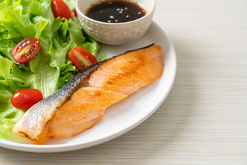grilled salmon fillet steak with salad