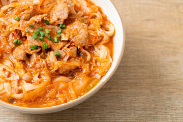 Korean udon ramen noodles with pork in kimchi soup