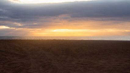 An empty beach at sunrise time.