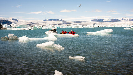 kayaking in Iceland next to an iceberg