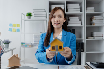 Housing project sales staff make sales presentations of various types of houses. to customers who visit and explain trading details. Home and real estate salesperson concept.