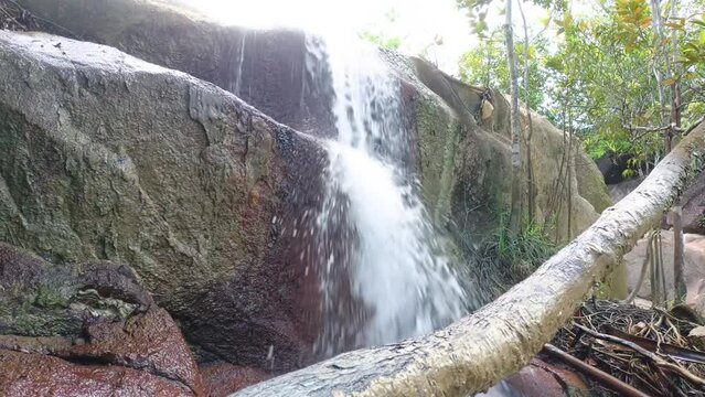 Small Waterfall Flowing From Large Rocks, In Daya Baru Village, Indonesia