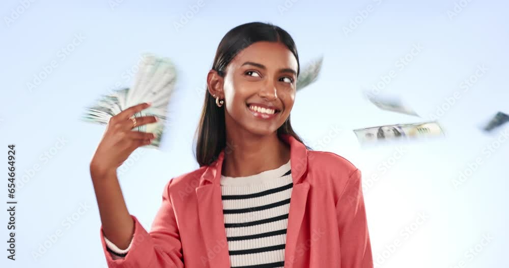 Poster Woman, winner and money rain or fan for bonus, success and winning of lottery prize, profit or cashback in studio. Happy indian person with cash in air and financial freedom on a blue background