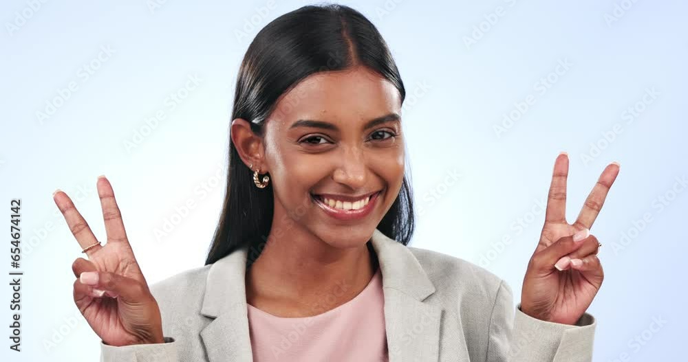 Canvas Prints Business, happy woman and sign of peace in studio for winning, vote and celebrate success on blue background. Portrait, indian worker and show v icon, trust and emoji for support, winner and feedback