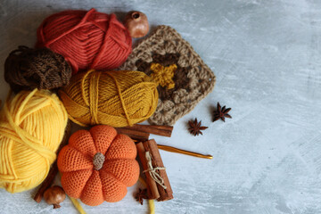 Autumn crocheting ideas. Cute crocheted amigurumi toys, wool yarn, crochet hook. Space for text. 