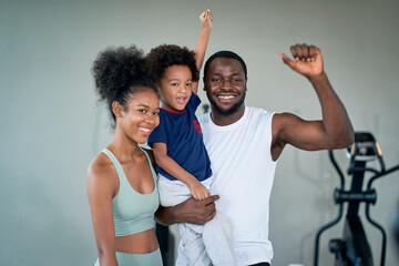 African american family portrait in fitness and sportclub for healthy together.