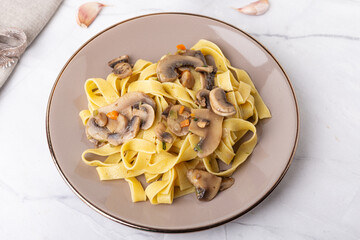 Fettuccine With Mushrooms. Typical dish of the Italian tradition, suitable for those who follow a vegetarian diet.