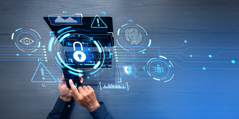 Businessman finger touch phone, laptop with digital cybersecurity dashboard hud