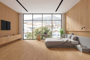 Wooden and white bedroom with desk and TV
