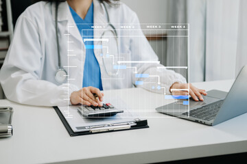 Project manager working and update tasks with Gantt chart scheduling diagram at hospital .success smart medical doctor working with smart medical doctor