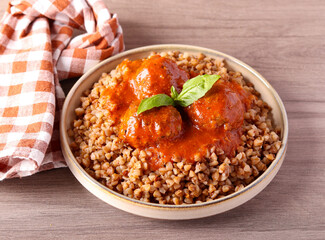 Meatballs in tomato sauce and buckwheat