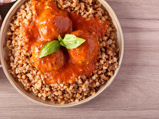 Meatballs in tomato sauce and buckwheat