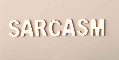  Sarcasm - written with wooden letters