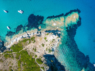 Aerial view of Corsica's step coastline and a lighthouse, Island, Mediterranean, France - 654719913
