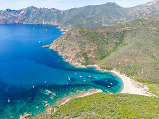 Aerial drone view of Port de Girolata, a remote village on Corsica island, France, Europe. - 654728982