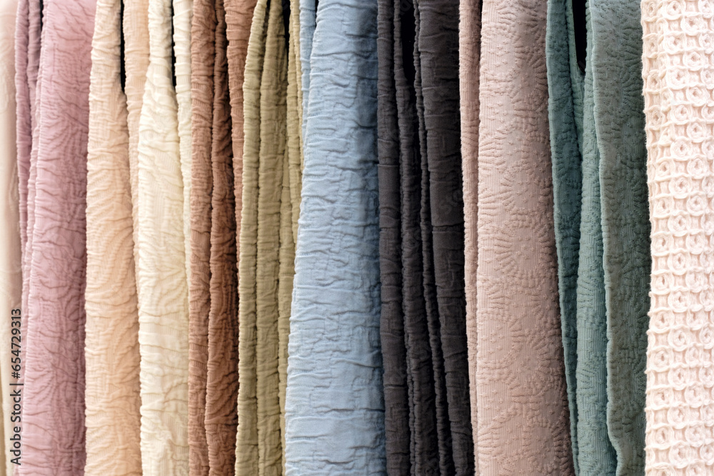 Aufkleber mix colorful hanging vertical stripe textile, fabrics, cloths on the rack. texture of multicolored f