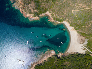 Aerial drone view of beach and sailboat yachts on Corsica island, France, Europe. - 654729322