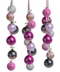 Bundle of New Year's Christmas balls pink lilac black gold color on a white background. Balloons hang on a ribbon with a bow.