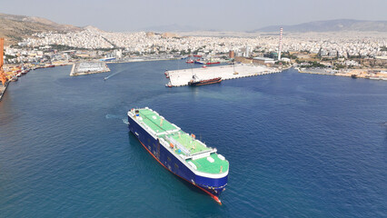 Aerial drone photo of Roll on Roll off automobile carrier ship cruising near terminal port of Perama, Attica, Greece