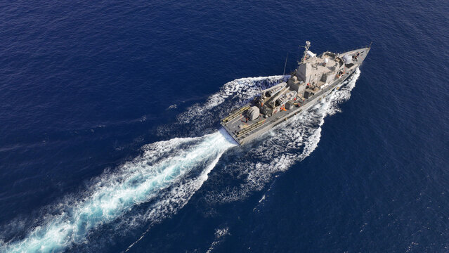 Aerial drone photo of armed navy frigate cruising deep blue sea