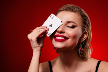 Photo of stunning woman wear black dress playing cards close eye empty space isolated red ruby color background