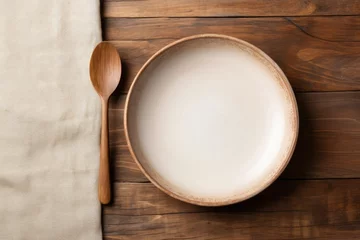 Foto op Plexiglas Ceramic dish and wood utensils on table © The Big L