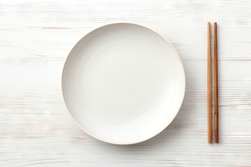 Ceramic plate and chopsticks on white table - obrazy, fototapety, plakaty