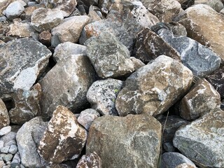 A close up big light gray stone texture for background, a stone background or a gravel stone wall texture pattern 