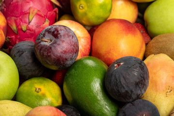 Various fruits colorful, clean eating, Fruit background. Fresh fruits. Grape, Fig, Strawberry, apple, pear, kiwi, peach
