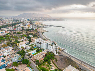 Fototapeta premium Aerial view of the Barranco neighborhood in Lima, Peru in 2023. Spanish colonial style historic buildings. Neighborhood with new houses and also many houses degraded by time. Gastronomic region 