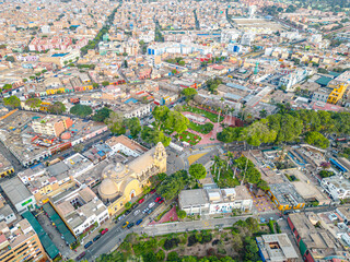 Fototapeta premium Aerial view of the Barranco neighborhood in Lima, Peru in 2023. Spanish colonial style historic buildings. Neighborhood with new houses and also many houses degraded by time. Gastronomic region 