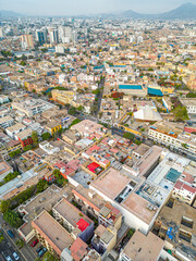 Fototapeta na wymiar Aerial view of the Barranco neighborhood in Lima, Peru in 2023. Spanish colonial style historic buildings. Neighborhood with new houses and also many houses degraded by time. Gastronomic region 