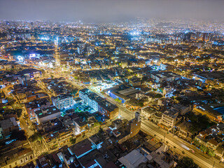 Obraz premium Night aerial image of the Barranco region, Lima. Peru. Homes, businesses and nightlife in 2023.
