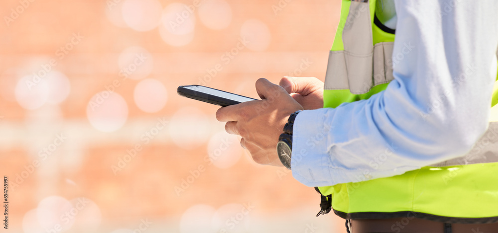 Aufkleber Hands of engineer on construction site, typing on phone and checking email for building schedule with mockup. Architecture, communication and business man with cellphone reading text, chat or report.