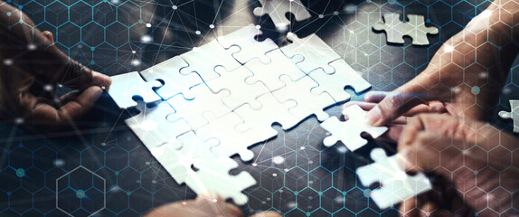 Collaboration, business and hands with puzzle in overlay at workshop, hexagon grid and corporate connectivity. Digital hologram, teamwork and cooperation with networking, ideas and problem solving.