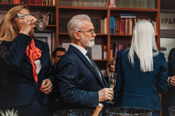 Accomplishment and celebration as diverse business professionals toast to their successful achievements and commemorate a memorable year together.