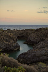 El Charco de Archiles near Amarilla Golf in San Miguel de Abona. Tenerife. It is a natural pool that is filled with sea water. Its location at the mouth of a ravine makes it look like a small river. 