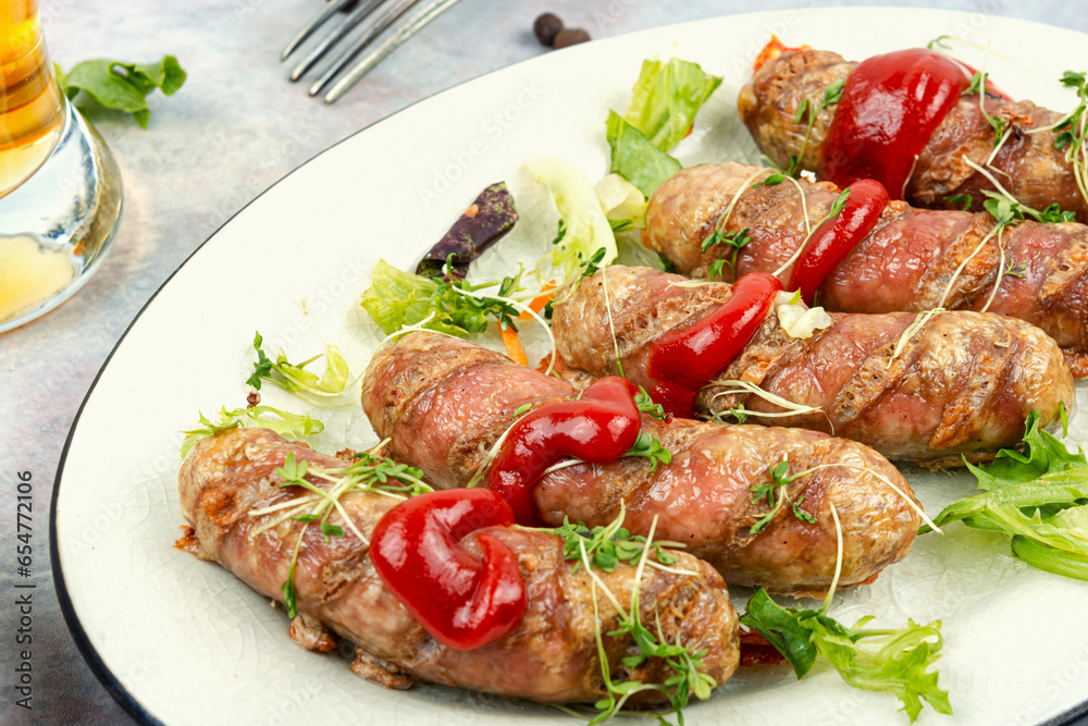 Wall mural Fried sausage on plate