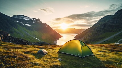 wild camping in the Lofoten islands. camping tent among mountains. sunset over a camping spot behind the Polar Circle. Panorama of the perfect landscape during the midnight sun - obrazy, fototapety, plakaty