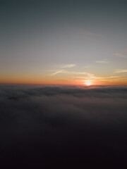 Sunrise above the clouds seen from drone