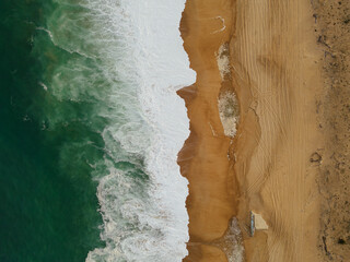 Beach and waves seen from drone